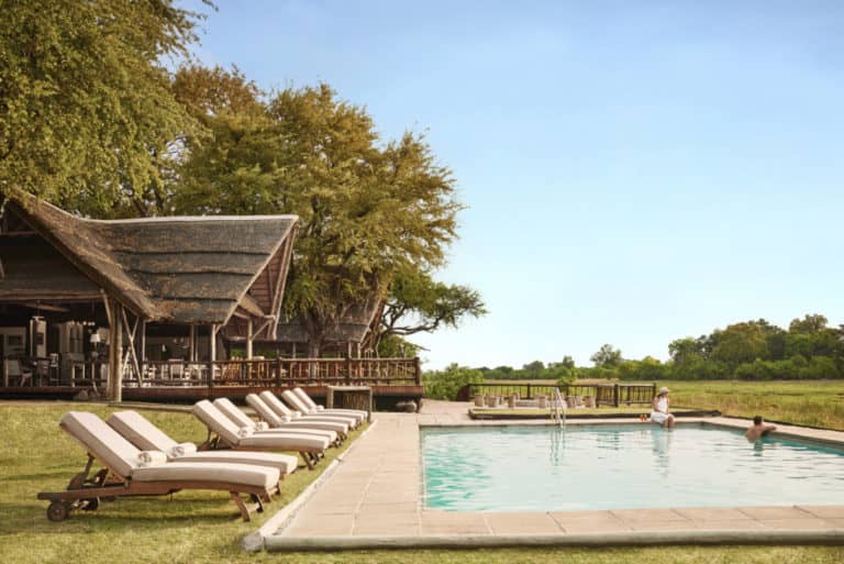 Swimming pool and loungers at Khwai River Lodge
