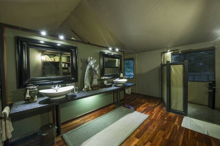 Twin basins in the luxury ensuite bathroom at Chitabe Camp