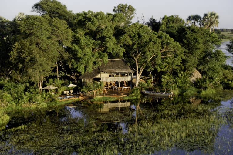 River view of Jacana Camp surrounded by trees