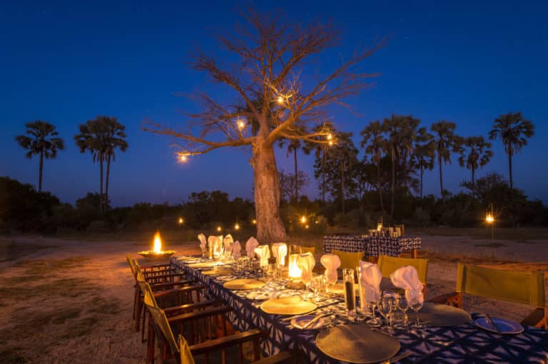 Bush dinner set up by lantern light at Kwetsani camp