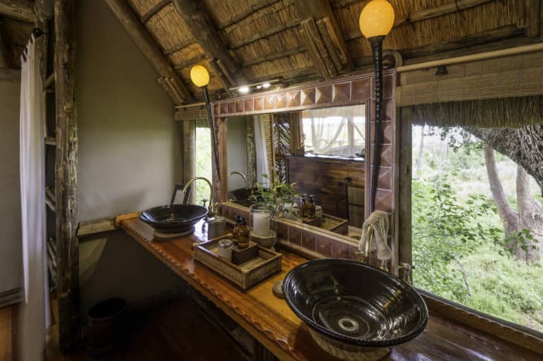 Twin basins in ensuite bathroom at Kwetsani luxury camp