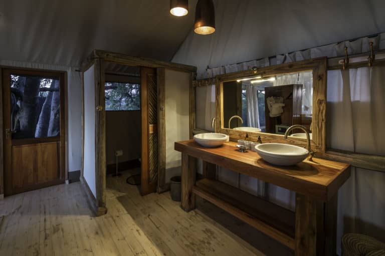 Twin basins in luxury en suite bathrooms at Little Tubu Camp
