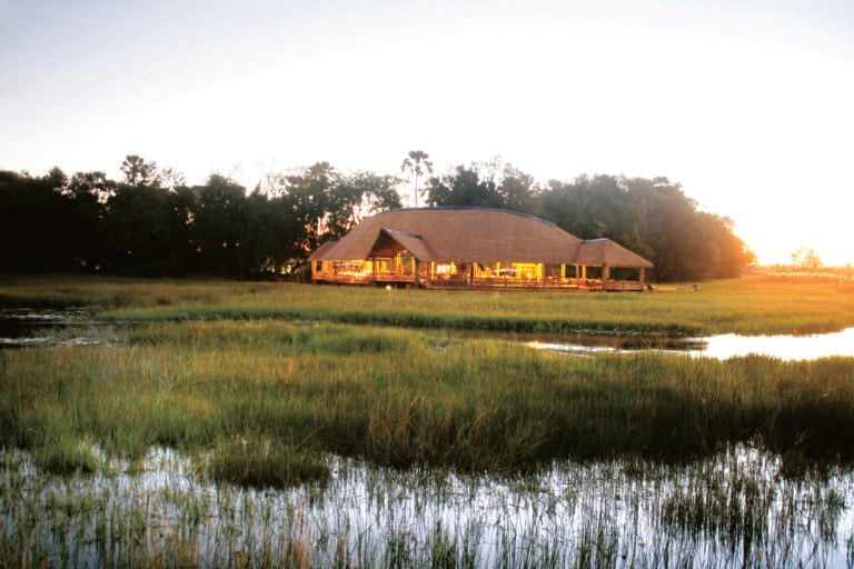 Scenic view of lit Moremi Crossing lodge
