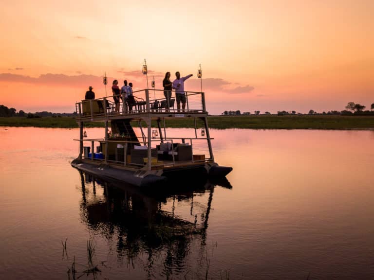 Sundowners by boat at King's Pool Camp