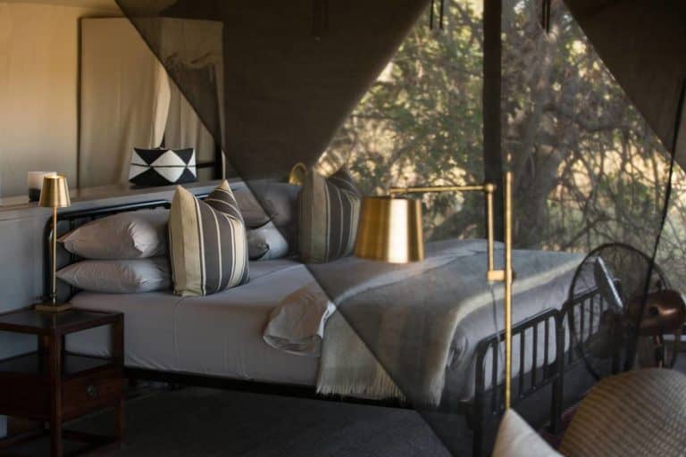 Elegant guest tent interior at the exclusive Little Machaba Camp