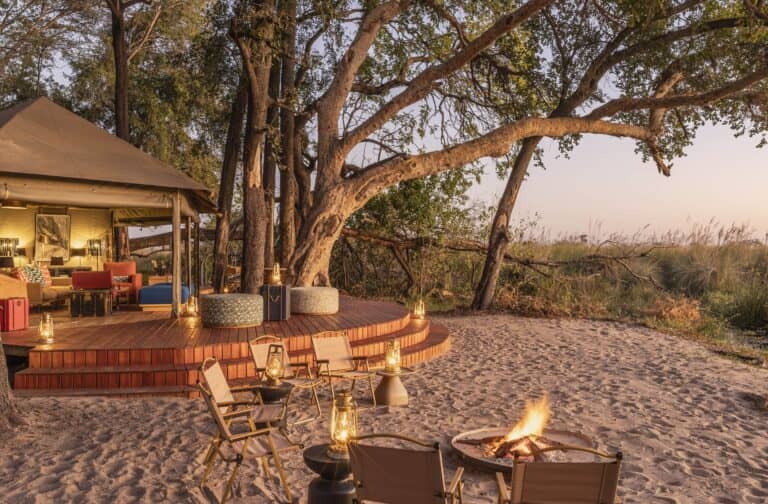 The main area at Shinde Footsteps Camp combines the dining room, lounge and fire pit overlooking the Okavango waters