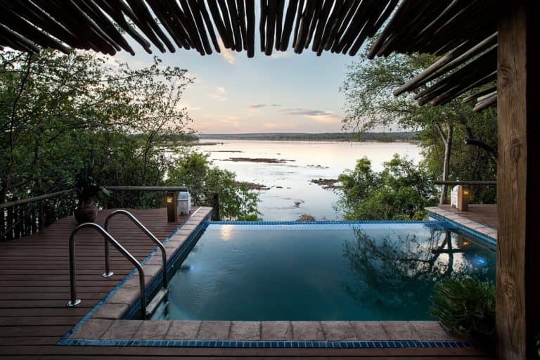 Tongabezi Nuthouse's pool appears to flow into the Zambezi river