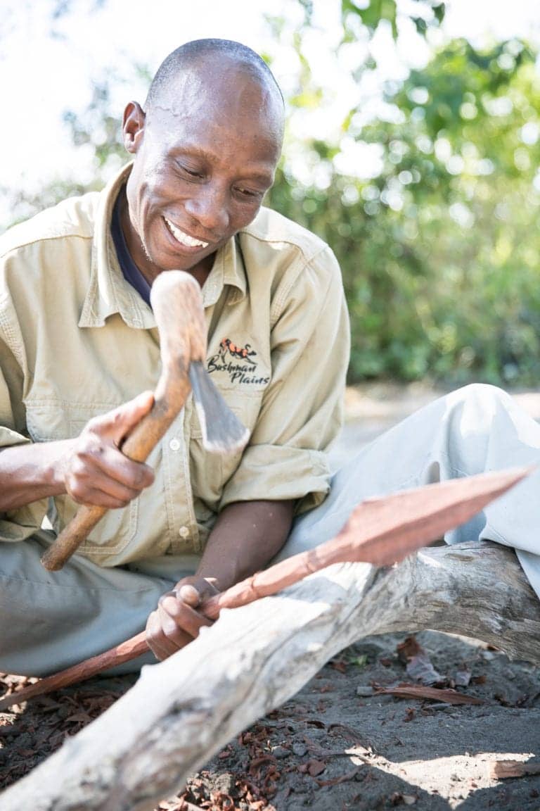 Carving a spear the traditional way at Bushman Plains Camp