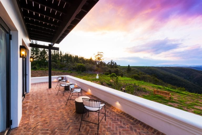 Guests enjoy incredible countryside views from the outside patio area at Fairview House