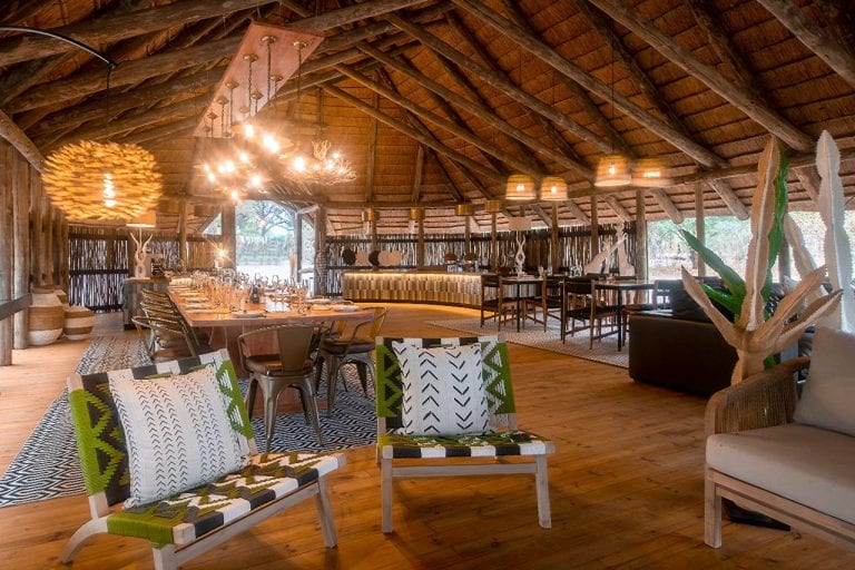 The main area under a large thatch roof at Mogotlho Safari Lodge